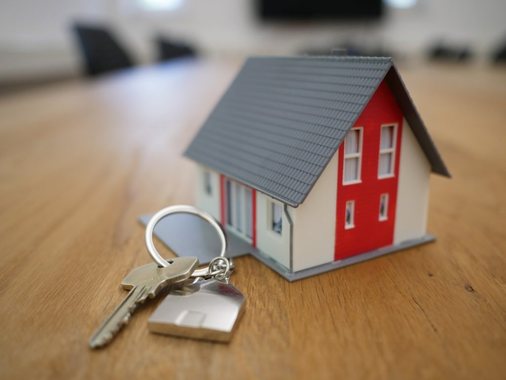 white-and-red-wooden-house-miniature-on-brown-table-rgj1j8sdeay Shooting in my office